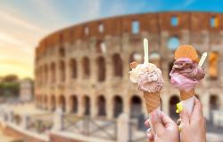 Hands holding gelato cones in front of Colosseum in Rome Italy