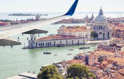 Plane flies above Venice