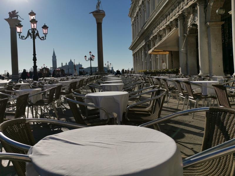 Empty tables in St. Mark's Square in Venice Italy 