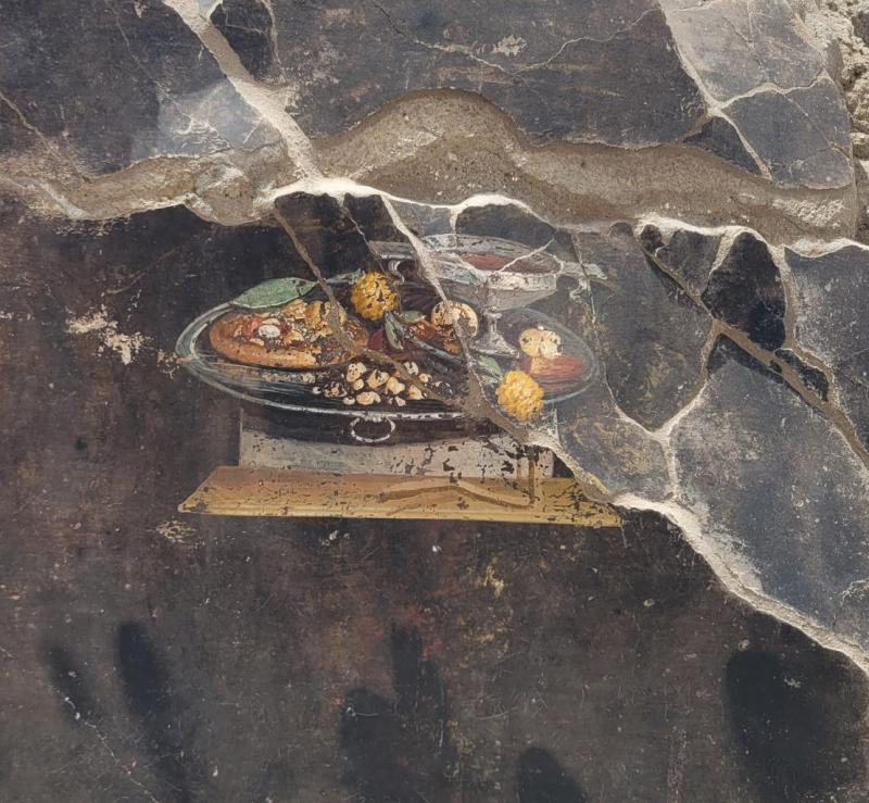 Detail of the fresco depicting what may be an "ancestor" of modern pizza