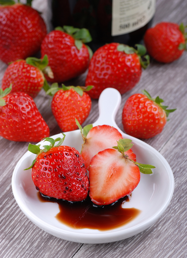 Strawberries with balsamic vinegar on the table