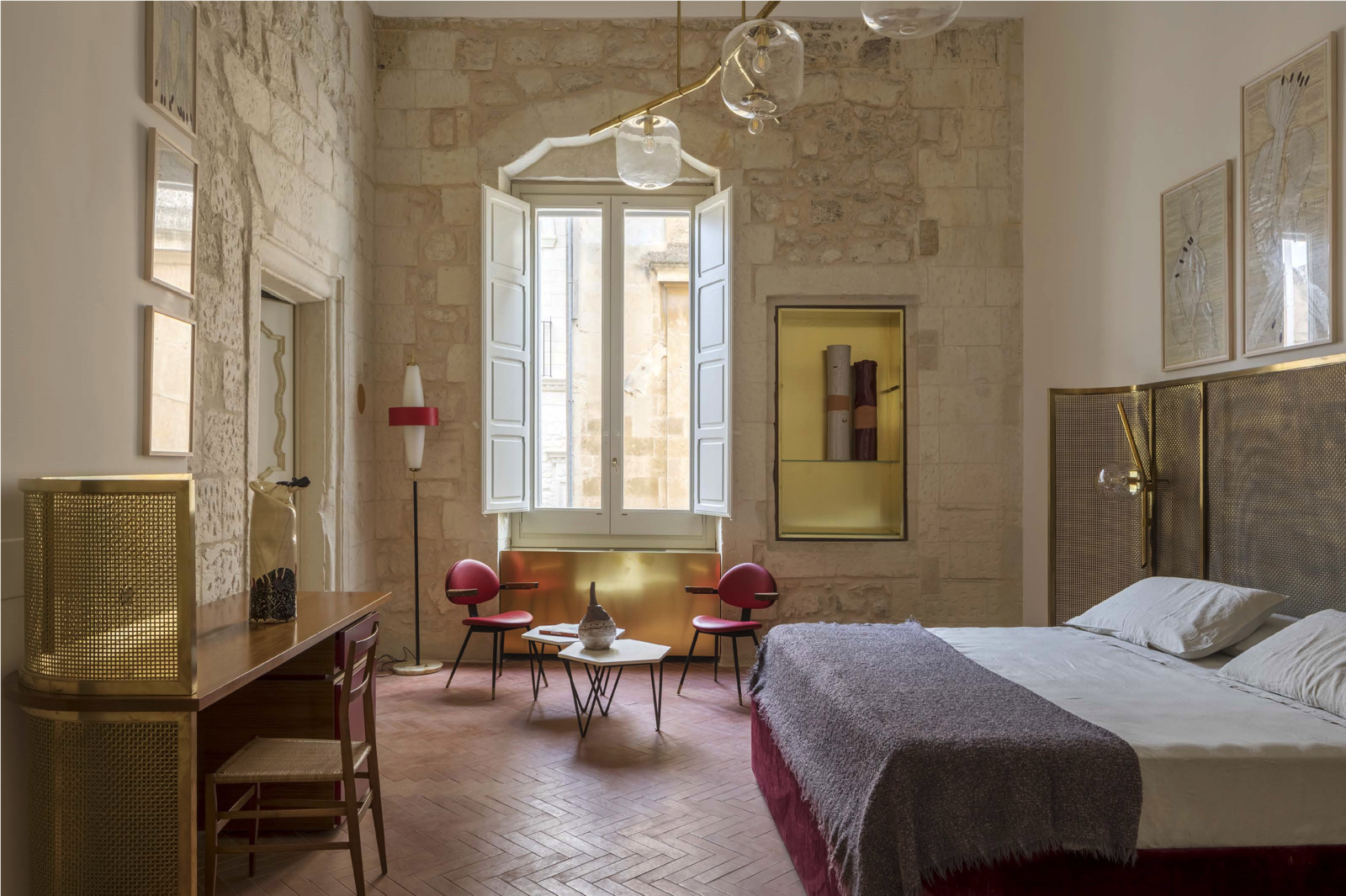 Suite at Palazzo Luce with bed and high-design chairs
