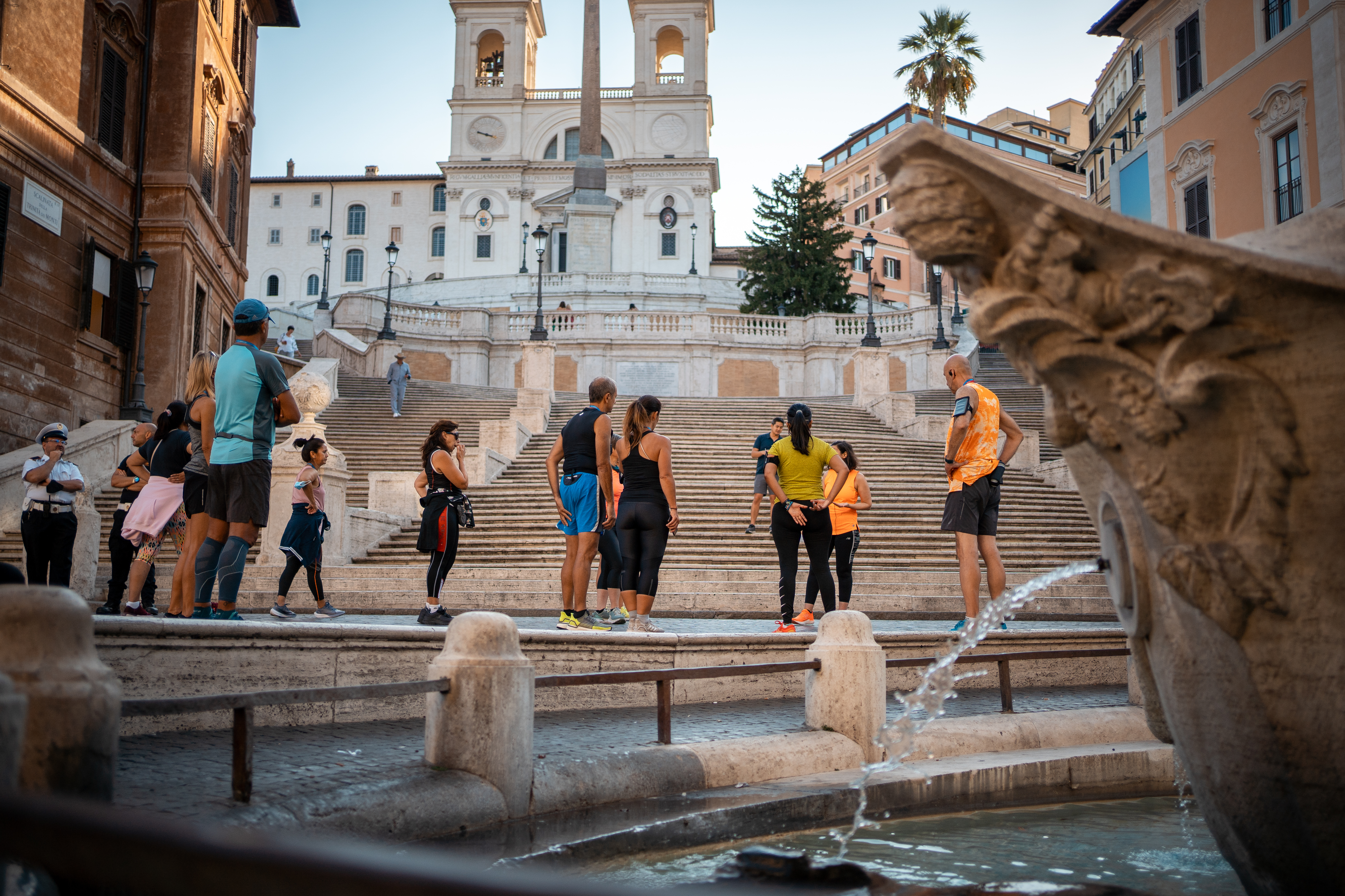 A group of runners stop at the Spanish Steps just as dawn is breaking, enjoying the moment without any of the usual crowds