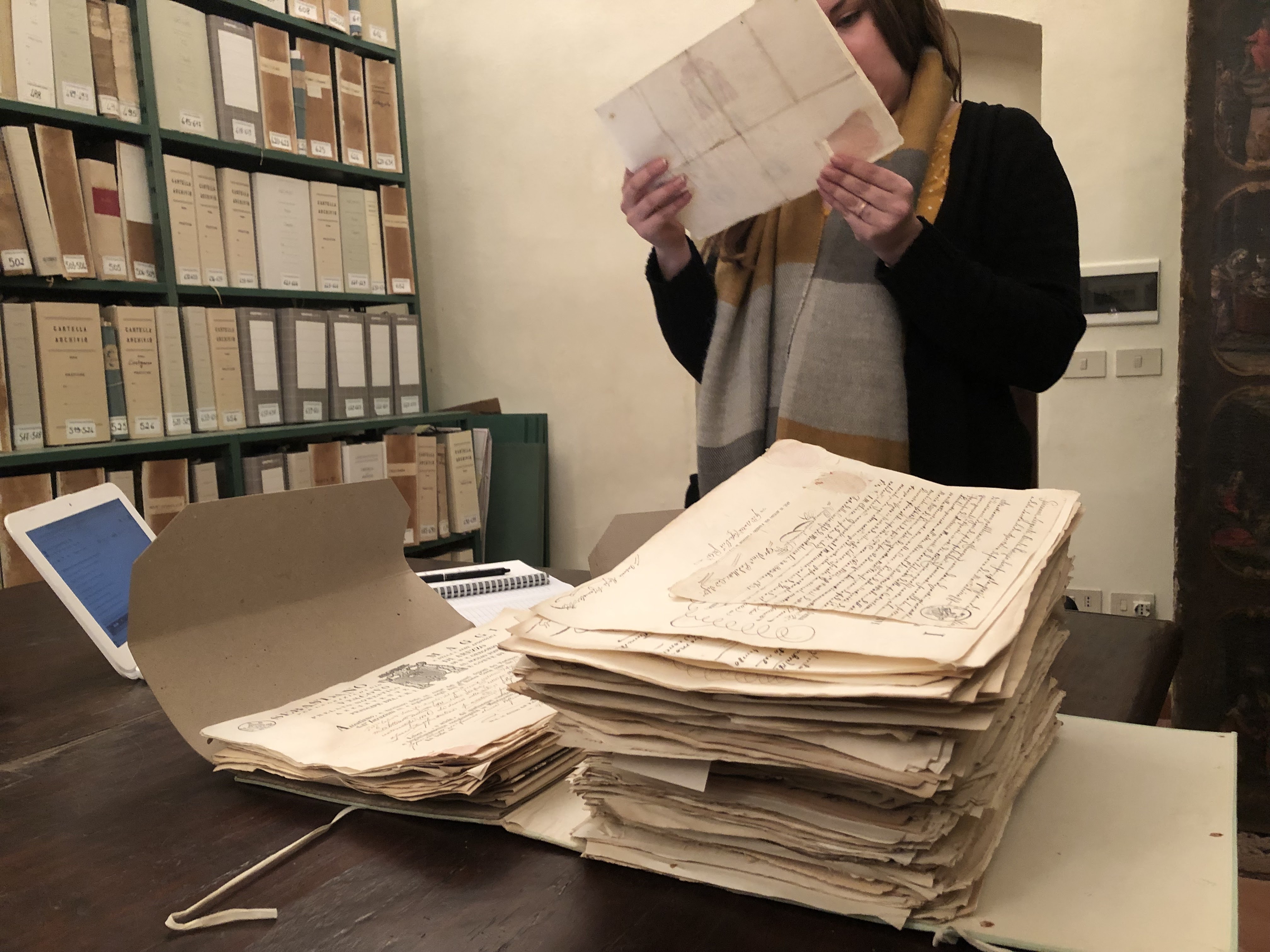 Megan studying family records at the archives in Pienza