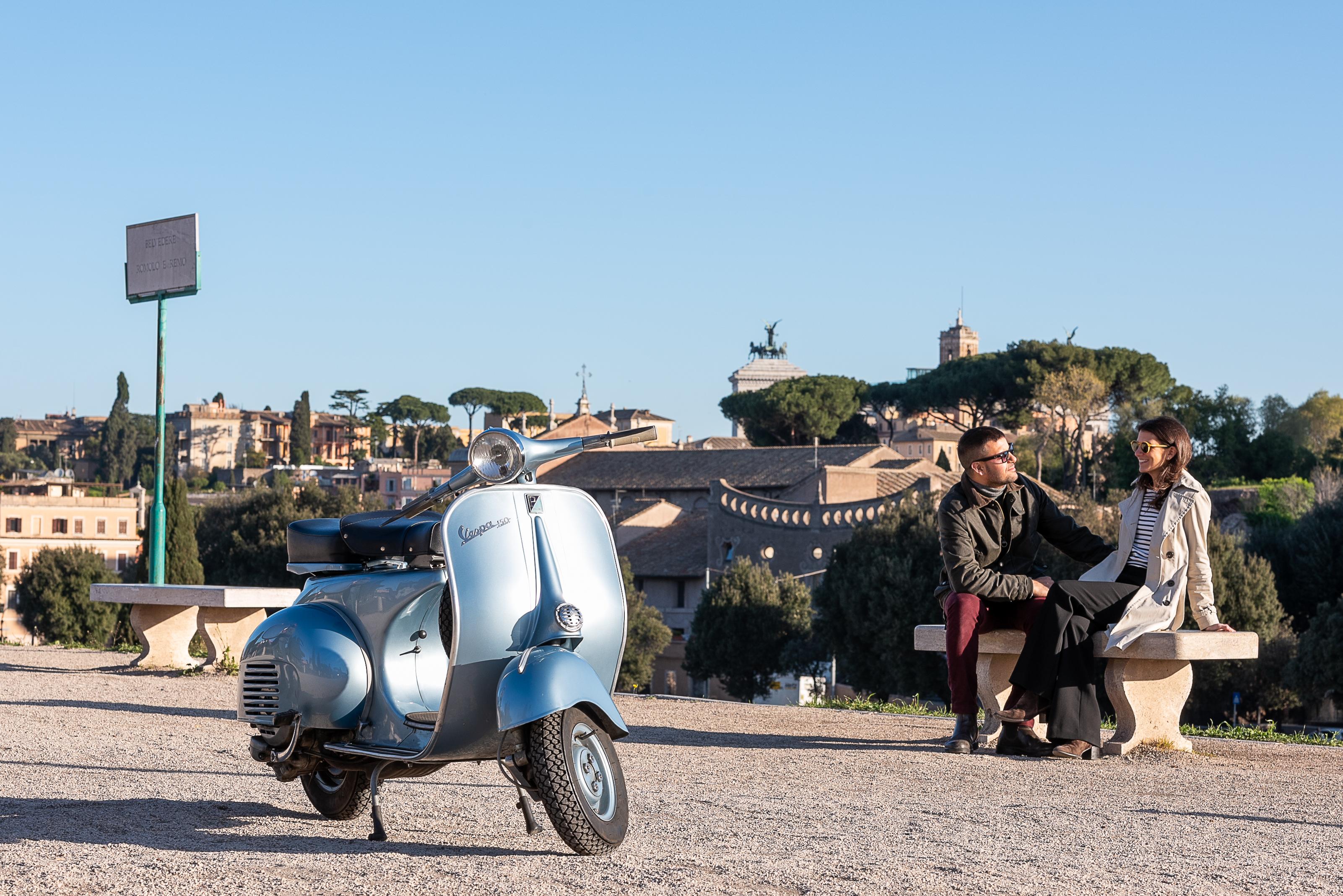 Couple on Vespa tour with view of Rome