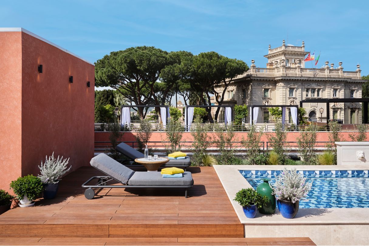 Rooftop terrace with lounge chairs and pool