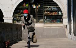 Woman walking with face mask in Italy