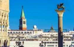 Large cruise ship sails past St. Mark's Square in Venice