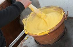 stirring polenta in large pot