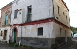 Historic country house with stone walls and garden and garage, original tiles from the 50s and seems solid and dry  0