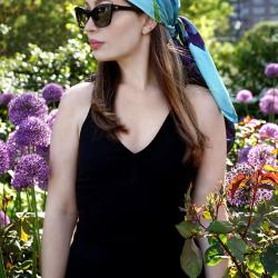 Orchid scarf worn by model as a headscarf