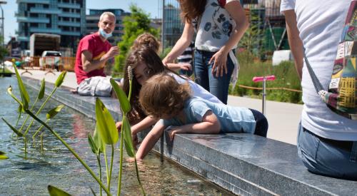 Children playing in Milan's Biblioteca degli Alberi park