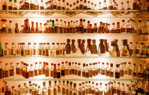 vintage grappa bottles on the shelves in Bassano del Grappa