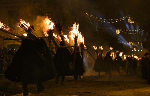 Men parade with torches at the 'Ndocciata ritual in Agnone, Molise