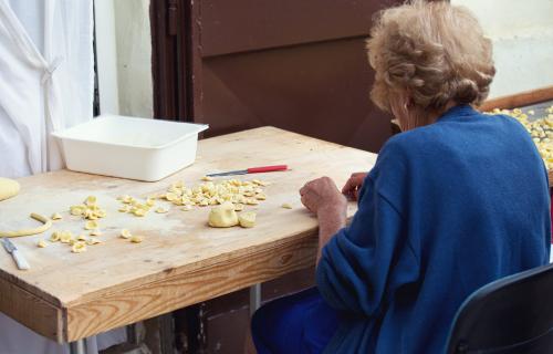 Woman making traditional orecchiette pasta in Bari, Puglia