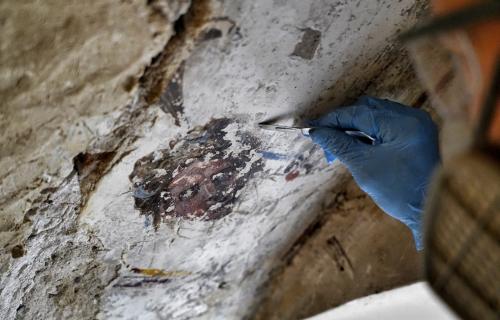 A restorer works in the "secret" staircase of Palazzo Vecchio