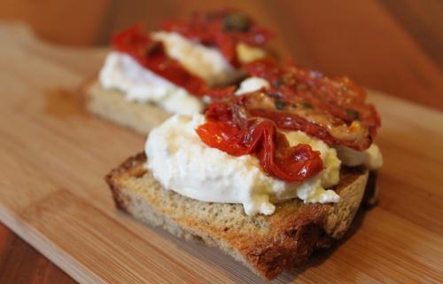 Crostini with Burrata Cheese and Sun-Dried Tomatoes. Ph. credit Coral Sisk