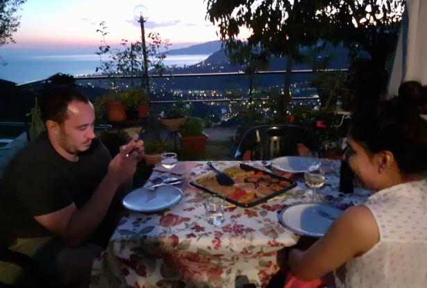 Dinner enjoyed in the garden at the sunset Dinner enjoyed in the garden at the sunset