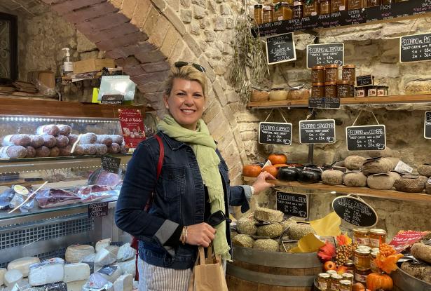 Stocking up on cheese & wild boar sausage in San Gimignano in Tuscany