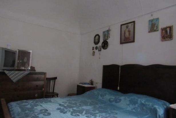 Historic center of town, perched on the hill top with amazing mountain views, 3 bedrooms habitable with outbuildings. 9