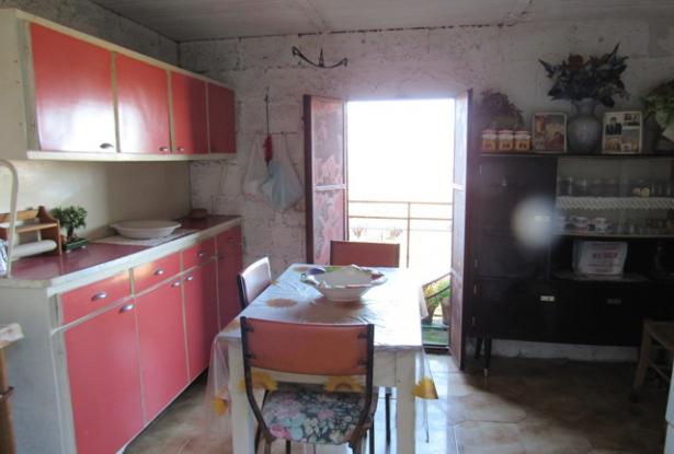 Historic center of town, perched on the hill top with amazing mountain views, 3 bedrooms habitable with outbuildings. 8
