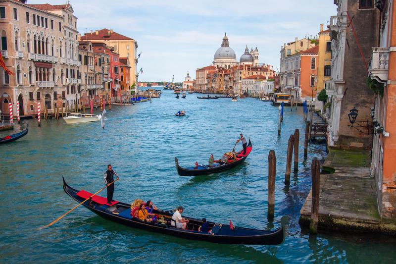 Gondolas on a canal in Venice Italy