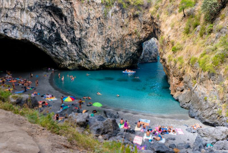 Arcomagno Italian beach called Arcomagno in calabria ionian sea with rocks natural arch