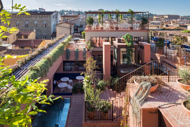 Rooftop bar in Florence with view of surrounding landscape