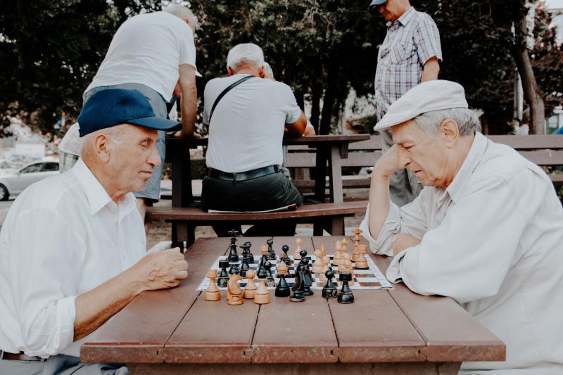 Older Italian men playing a game of chess