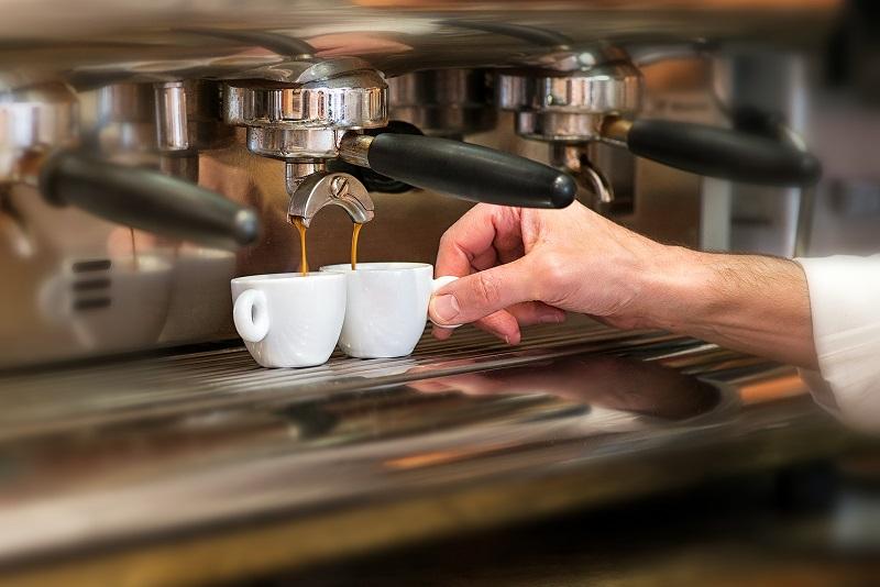 Man serving two coffee 