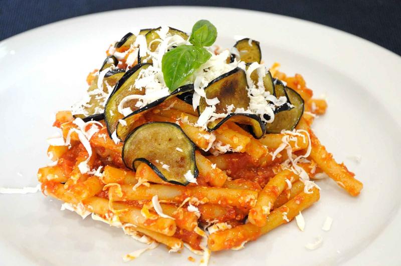 Pasta alla Norma from Sicily Pasta alla Norma dish with tomato sauce eggplant and basil