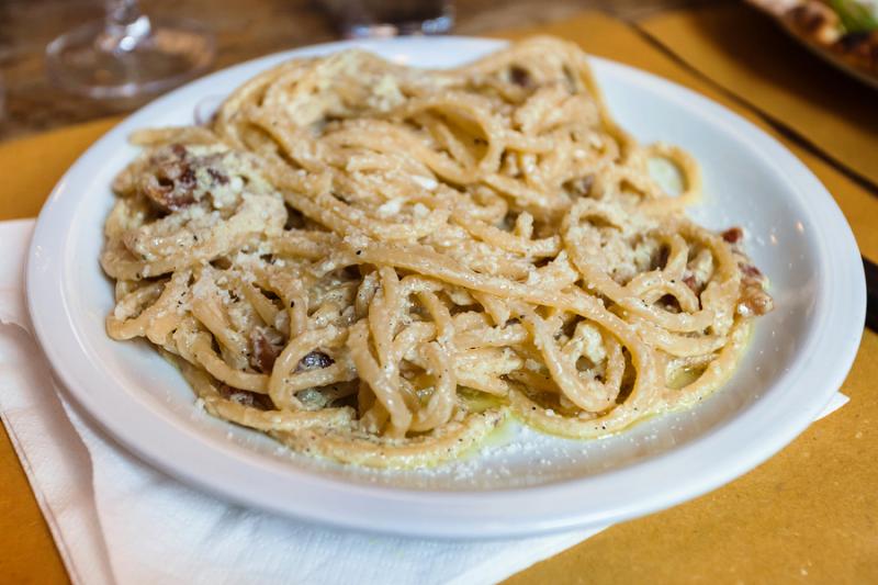 dish of pasta alla carbonara in a Roman trattoria