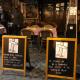 Trattoria in Rome displaying signs protesting the early closure of restaurants